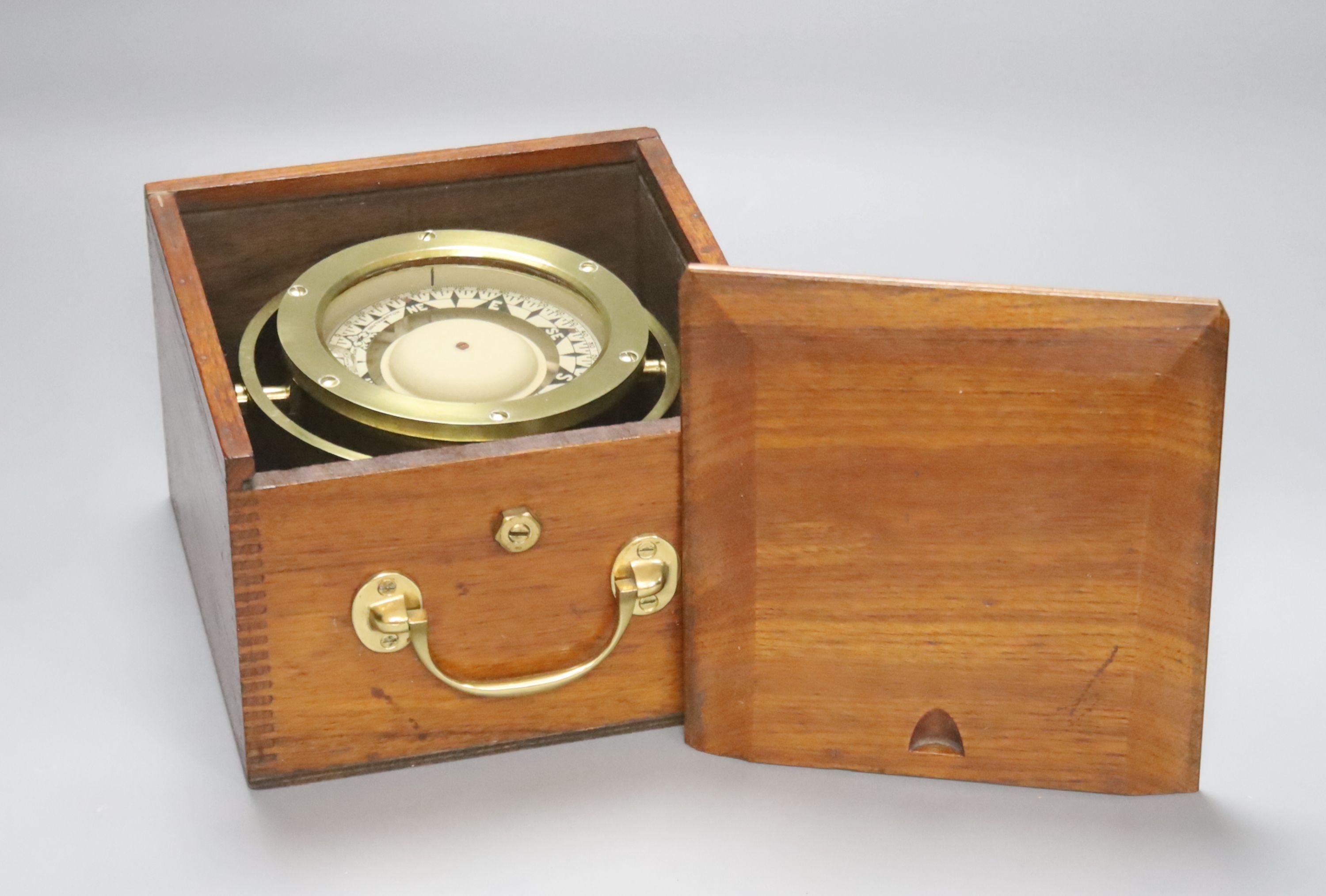 A mahogany cased brass marine compass on gimbal, marked F Smith & Son, Southampton.